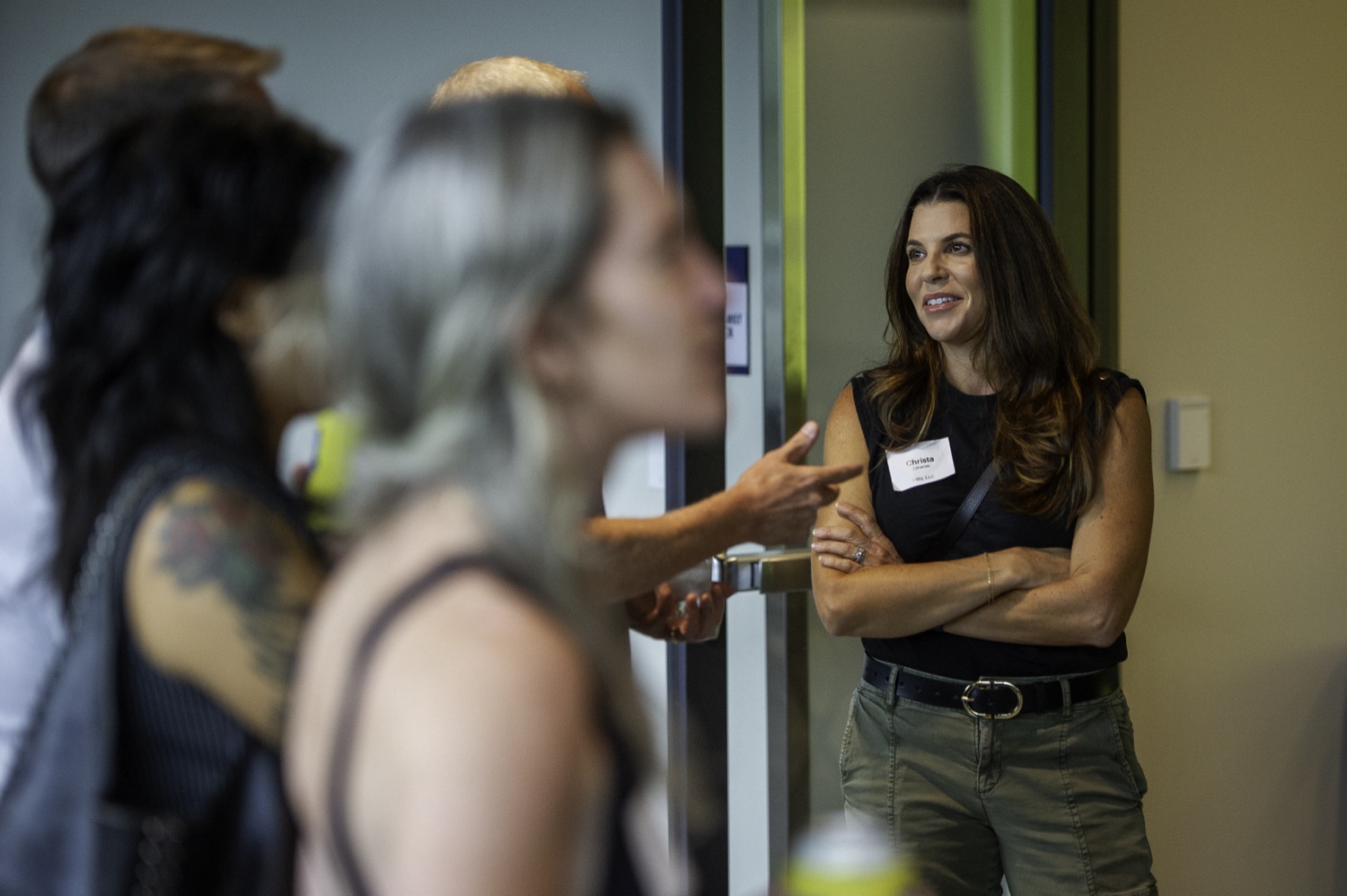 Kristen talking with guests at the Dynamic Tech Meetup.